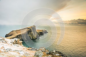 Isle of Skye winter landscape - Neist Point lighthouse and storm over ocean