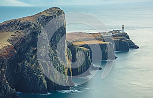 Isle of Skye winter landscape - Neist Point lighthouse and storm over ocean