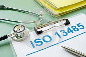 ISO 13458 documents and medical stethoscope with pen.