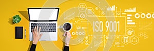 ISO 9001 theme with person using laptop computer