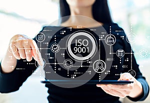 ISO 9001 with woman using tablet