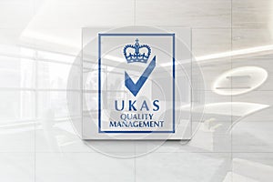Ukas quality management on glossy office wall realistic texture