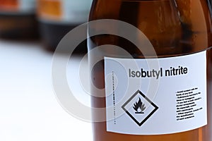 Isobutyl nitrite in glass, Hazardous chemicals and flammable symbols