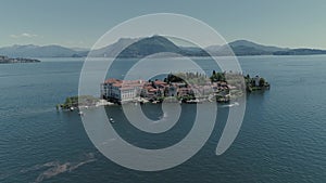 Isola Bella castle passenger ship voyage on the mountain Italy lake, drone 4k nature flight