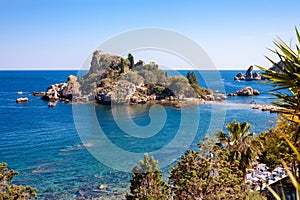 The Isola Bella island with the beach, excursion boats and bathe