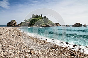 Isola Bella view in Taormina, Sicily, Italy. The beautiful small island with its beach pebbles and turquoise blue waters.