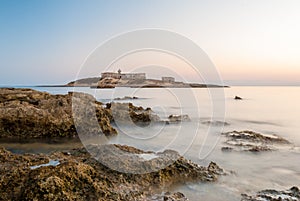 Isola delle Correnti, the most southern point in Sicily after the sunset photo