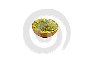 Isolate extract green tea powder in wooden bowl on white background.