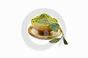 Isolate extract green tea powder in wooden bowl on white background. best ingredients for make useful drink.