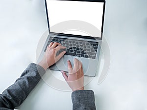 Isolate hand of a businessman using a laptop . Overhead shot of office desktop with hands working on laptop with copyspace