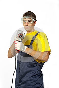 Isolate Man in yellow shirt coveralls with the drill