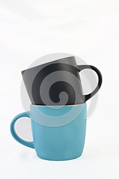 Isolate Mug Cup in color of black and blue in layer place. Use for create logo or mock up.