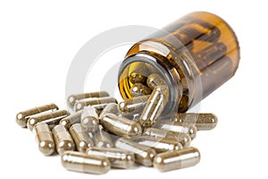 Isolate pills or tablets in the glass brown bottle on a white background