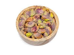 isolate of pistachio in a wooden bowl