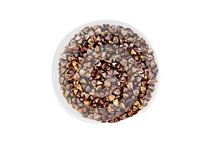 Isolate of unpeeled whole buckwheat seeds in the shape of a circle. Pseudocereal agricultural crop.