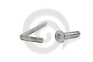 Isolated Allen screw driver wrench with a screw on white background