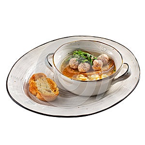 Isolated anelli soup with chicken meatballs