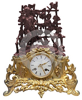 Isolated antique golden table clocks with statuette photo