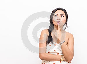 Isolated asian woman thinking about something