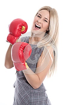 Isolated attractive blonde businesswoman ready to fight with box