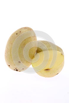 Isolated Australian potatoes. Cut raw potato vegetables isolated on white background with clipping path