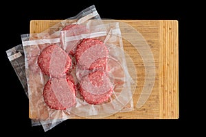 Isolated beef burger patties prepared for freezing