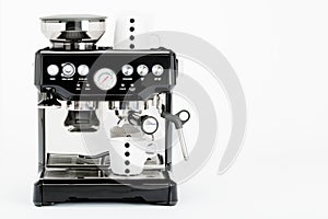 Isolated black manual coffee maker with coffee mugs on a white background