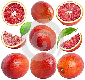 Isolated blood oranges. Collection of whole and cut red oranges of different shapes, leaves isolated on white