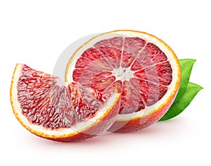 Isolated blood oranges. Half of red orange fruit and a piece with leaves isolated on white background with clipping path.