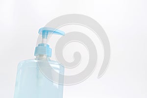 Isolated blue alcohol gel bottle and pump on white background