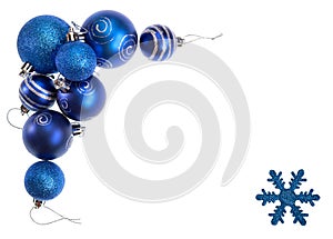 Isolated Blue Christmas Balls and Snowflake forming Border of a Decorative Frame