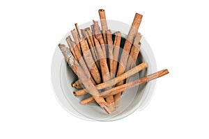 Isolated a bowl of cinnamon stick