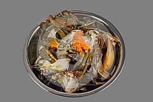 Isolated bowl of raw crab on the gray background