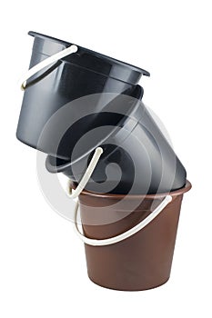 Isolated braun and black plastic buckets photo