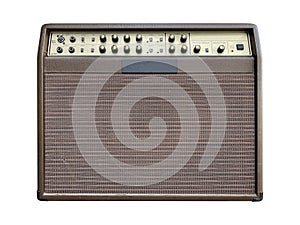 Isolated brown leather and gold control panel vintage acoustic guitar amplifier with black knob on white background.