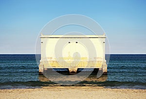 Isolated building on the sea, symmetric