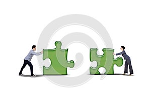 Isolated business partner putting together two puzzle