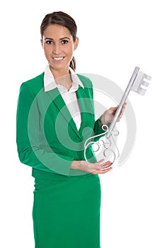 Isolated business woman in green holding key for dedicate a house.