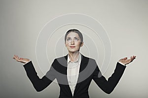 Isolated business woman hands up studio shot