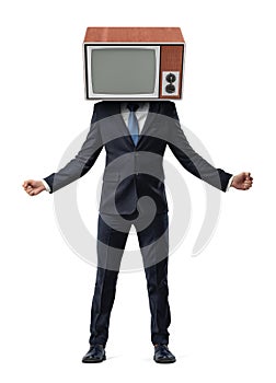 An isolated businessman stands holding arms wide and hands in fists while wearing a retro TV box on his head.