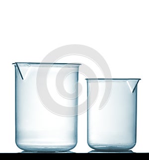 Isolated chemical plastic beakers on table