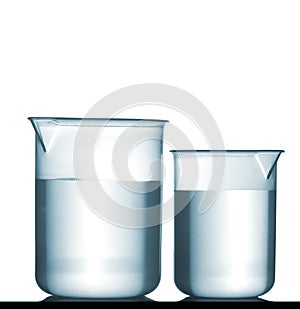 Isolated chemical plastic beakers on table with solution