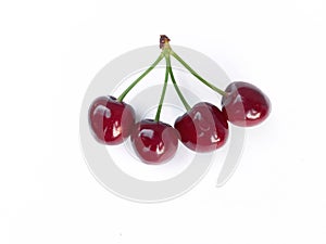 Isolated cherries. Three flying cherry fruits isolated on white background with clipping path