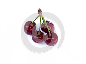 Isolated cherries. Three flying cherry fruits isolated on white background with clipping path