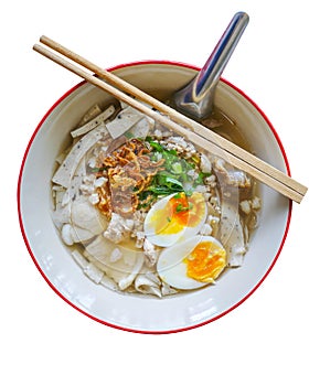 Isolated chinese food in thailand by top view, Local white noodle in chicken soup  with topping of pressed pork boiled egg