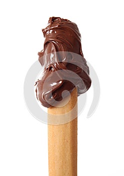 Isolated chocolate cream on breadstick in white background