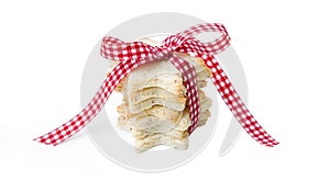 Isolated christmas cookies with a red checked ribbon
