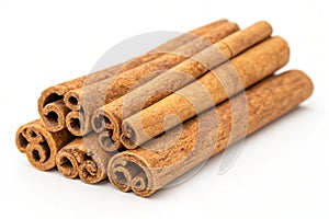 Isolated cinnamon sticks on white background photo
