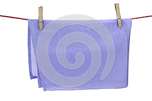 Isolated Clean Dry Violet Towel Hanging On A Red Rope