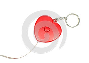 Isolated close up red heart measuring tape